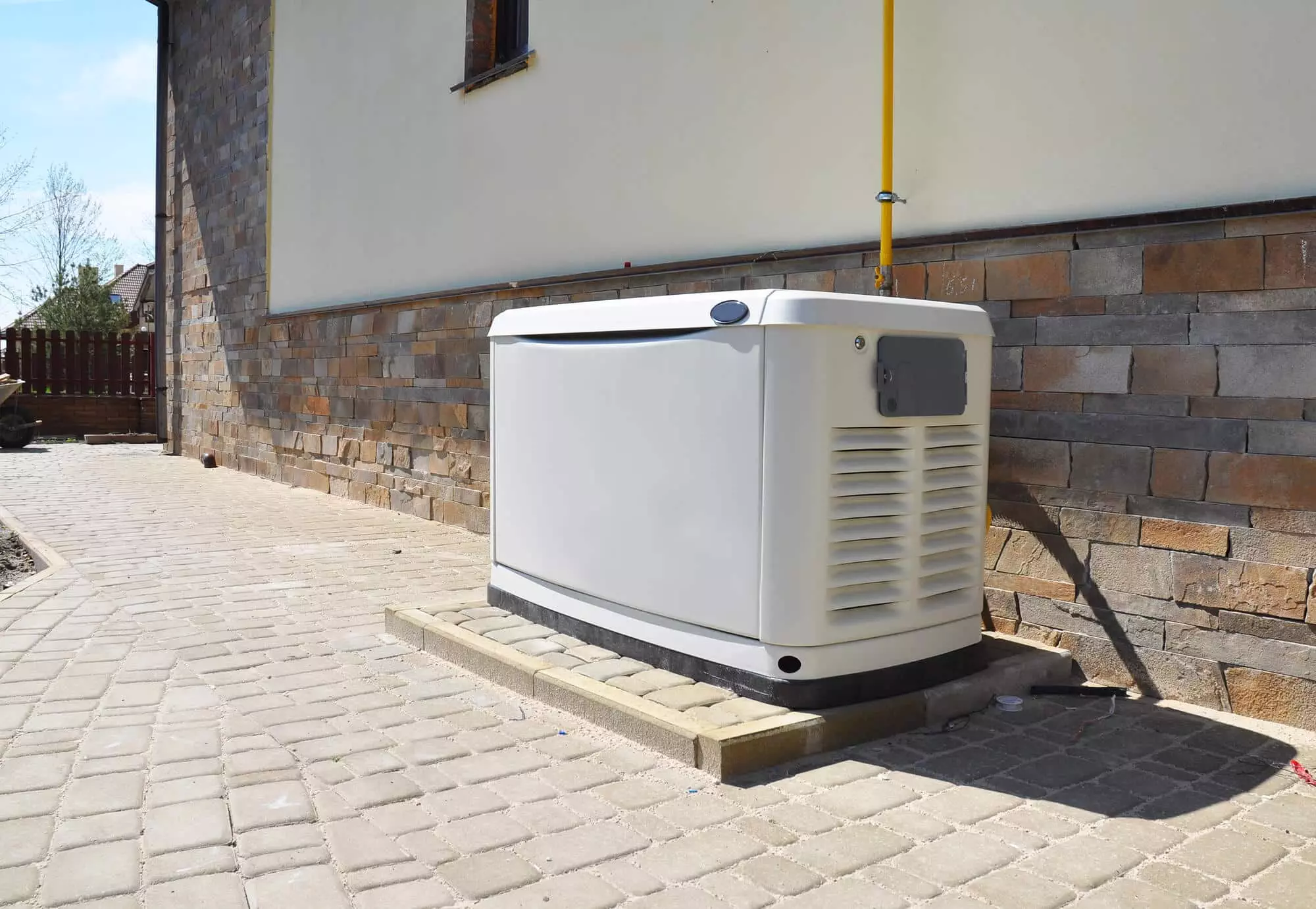 Picture of a backup generator installed outside a home